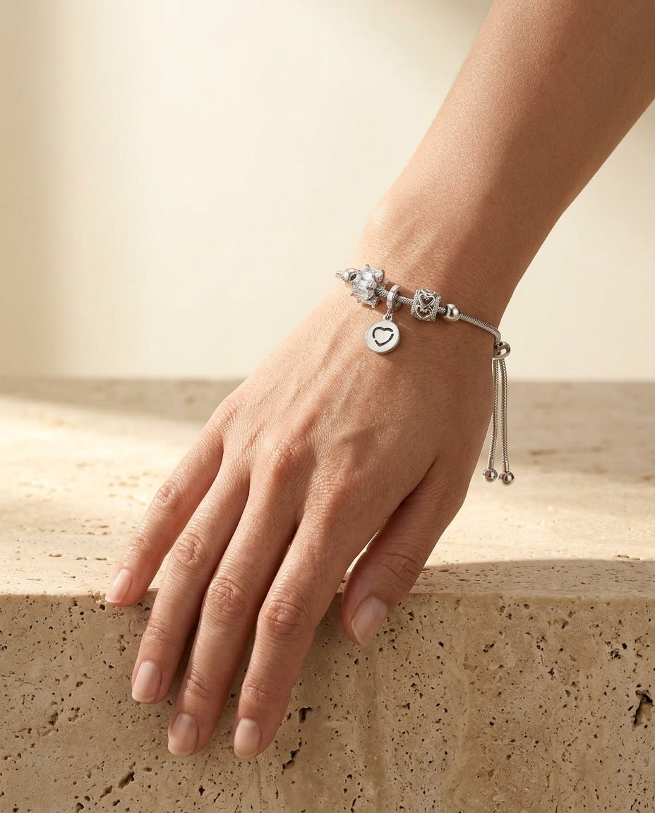 ALTUNA Love Charm Bracelet worn on the wrist, silver bolo slider bracelet with three charms