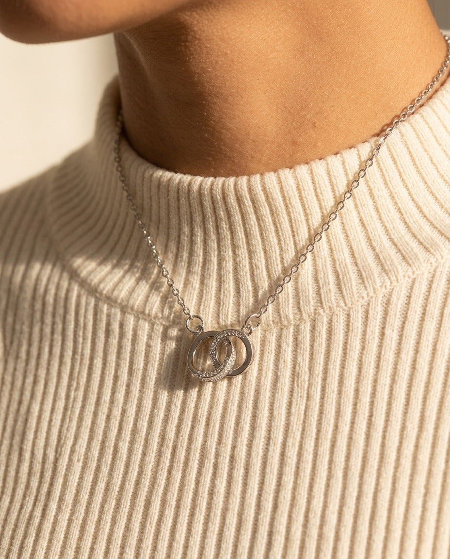 Armonia Necklace by ALTUNA worn over a warm ivory ribbed high-neck knit