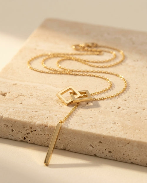 Carre Lumiere Necklace detail of interlocking squares and bar drop