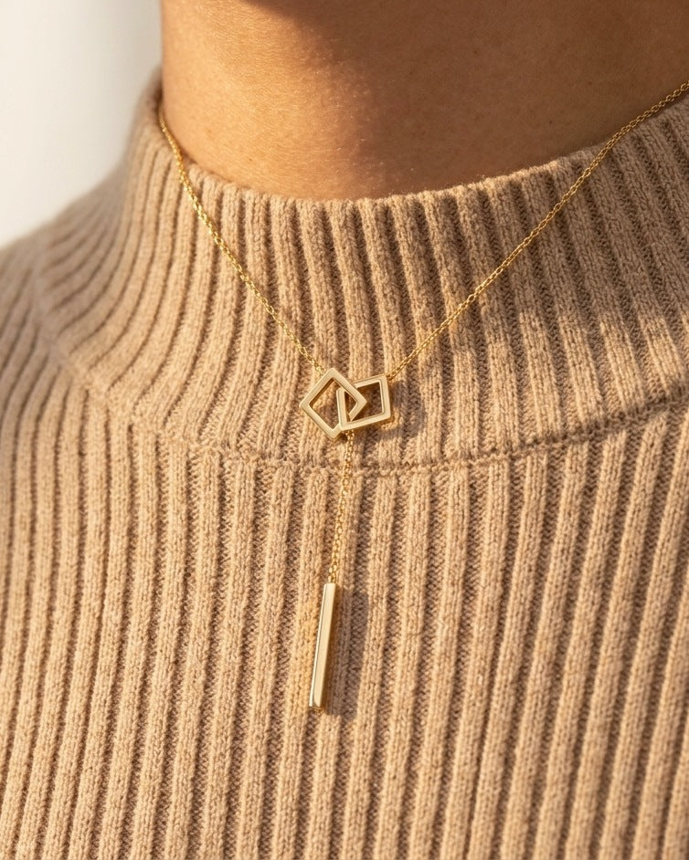 Carre Lumiere Necklace worn with a warm sand high neck knit
