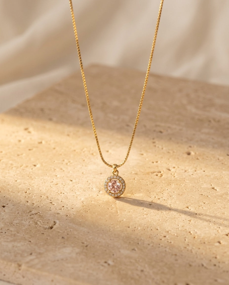 Celina Pendant Necklace in blush on warm travertine