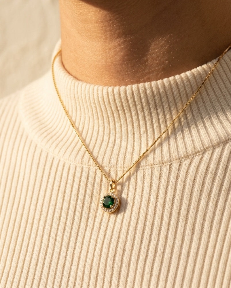 Celina Pendant Necklace in emerald worn over an ivory ribbed turtleneck
