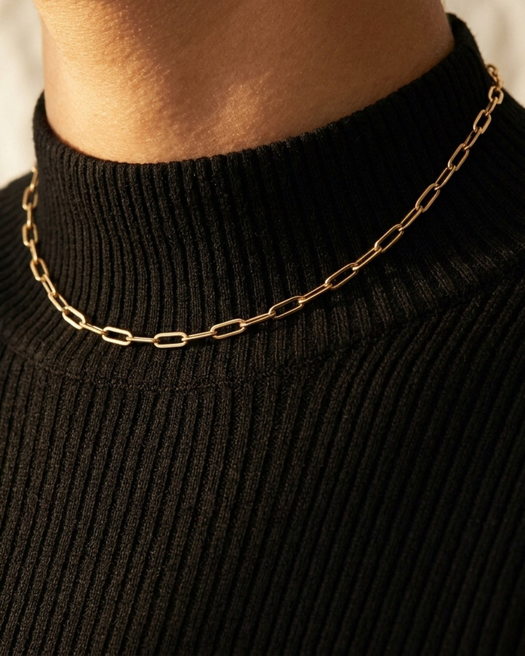 Céline Choker worn high on the throat over a black ribbed turtleneck, ALTUNA editorial