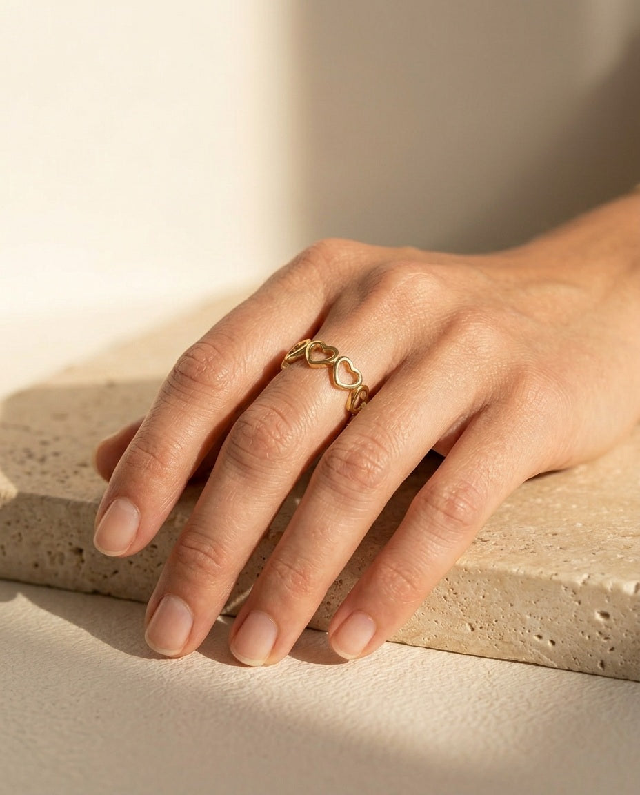 Endless Love Ring worn on the index finger in warm natural sunlight