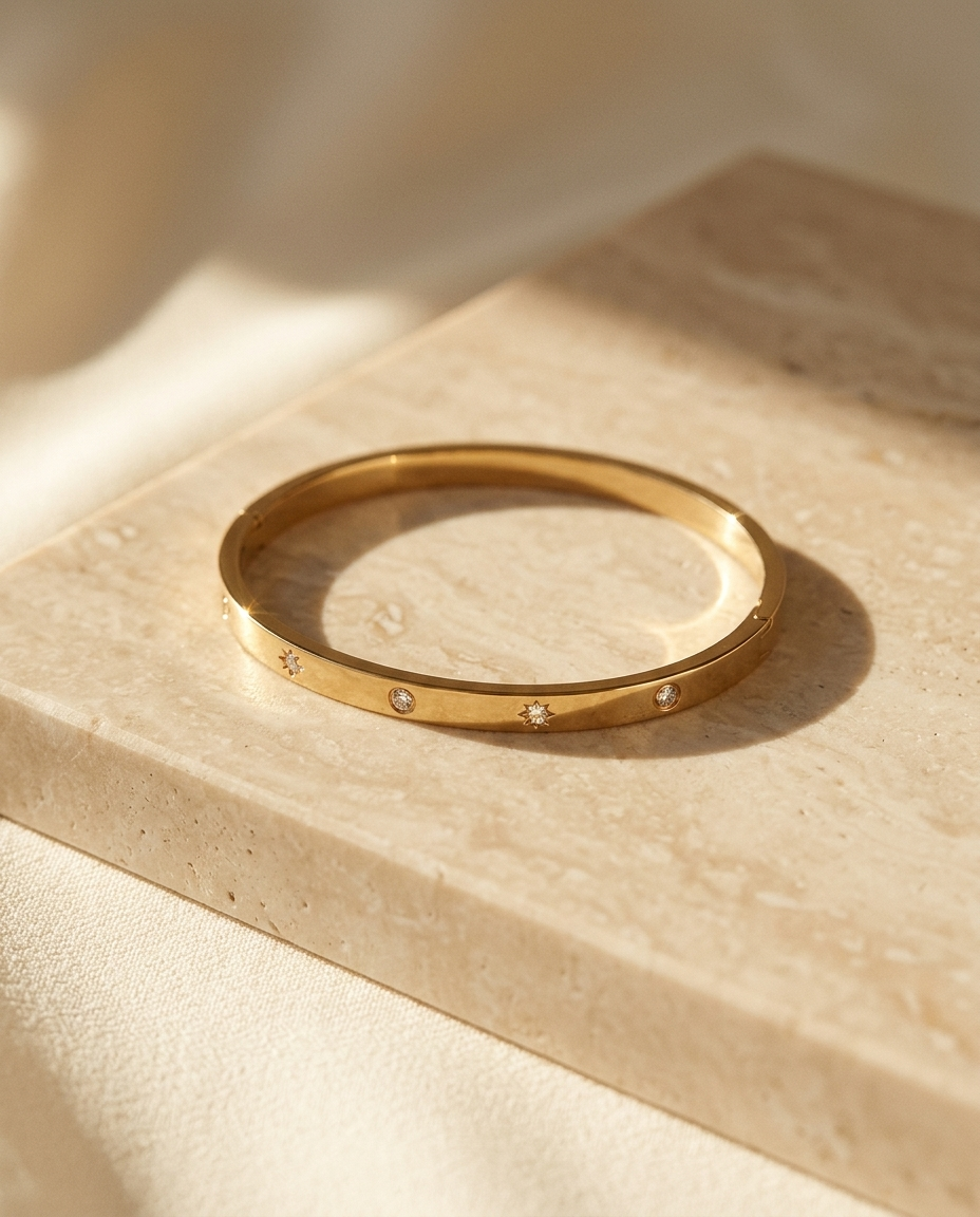ALTUNA Solène Diamond Bangle — editorial product photography on warm beige travertine