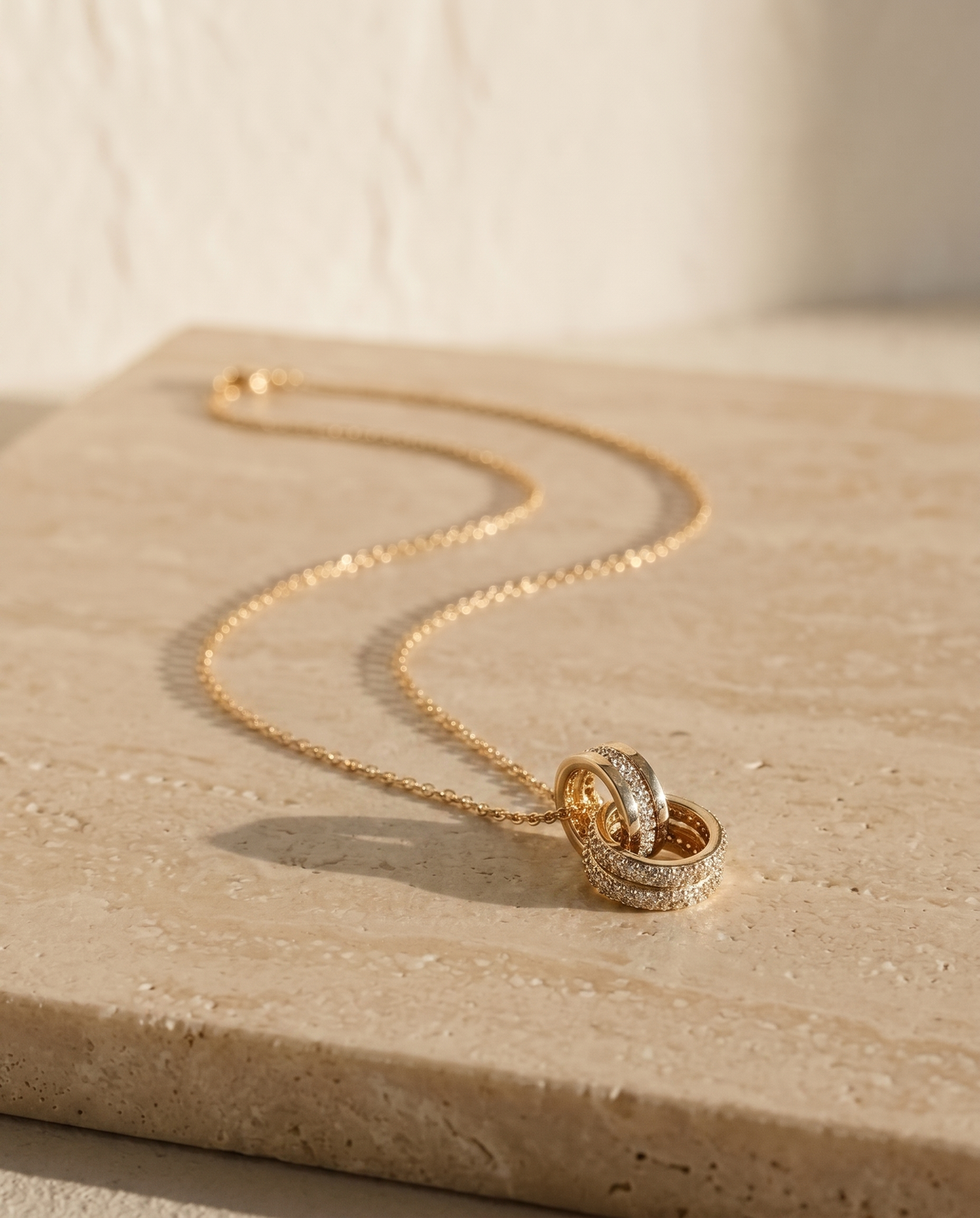Rêve Doré Necklace on travertine
