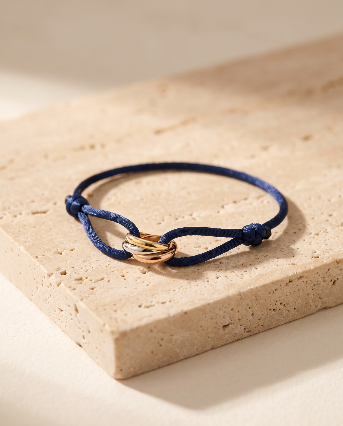 Triune Bracelet in navy cord with tri-colour interlocking rings
