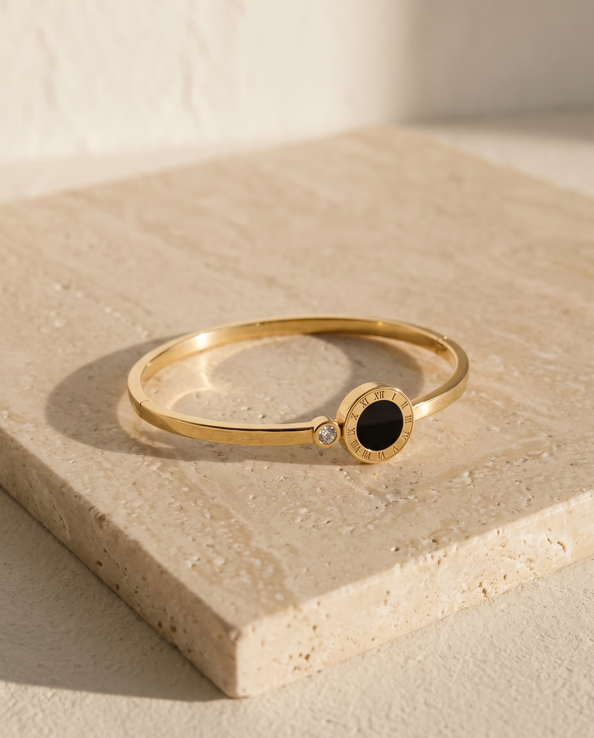 ALTUNA Eterna Bracelet — editorial product photography on warm beige travertine