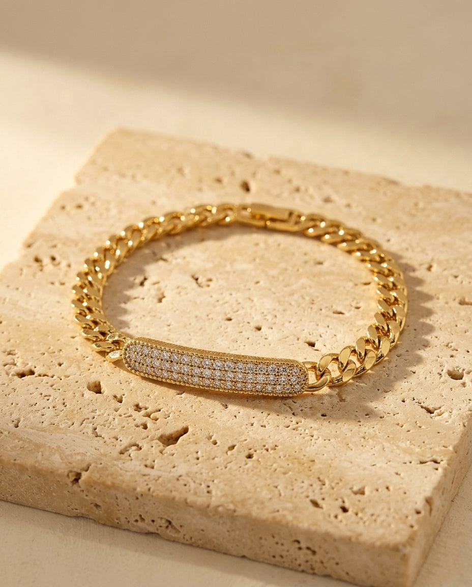 Opéra Bracelet resting on warm travertine in soft golden light