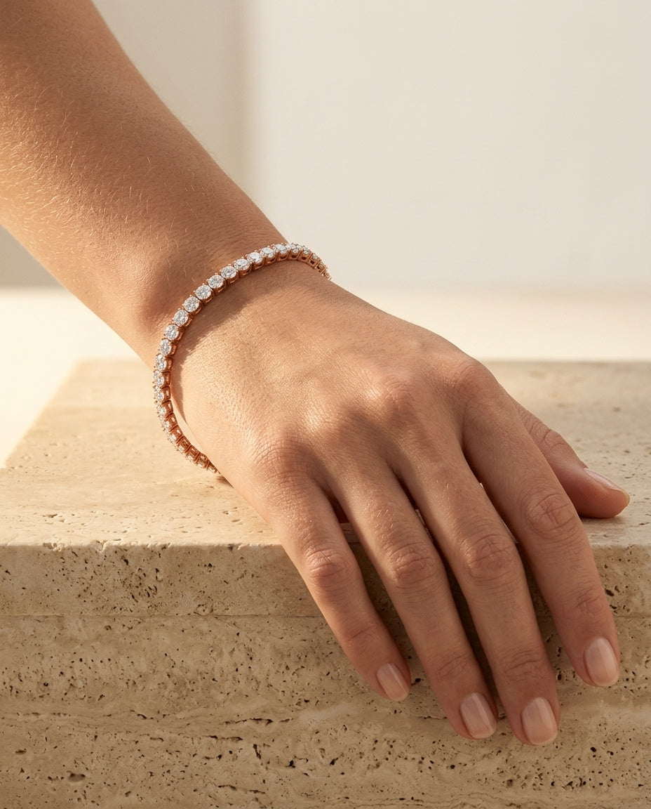 Roselle Bracelet rose gold tennis bracelet worn on a woman's wrist