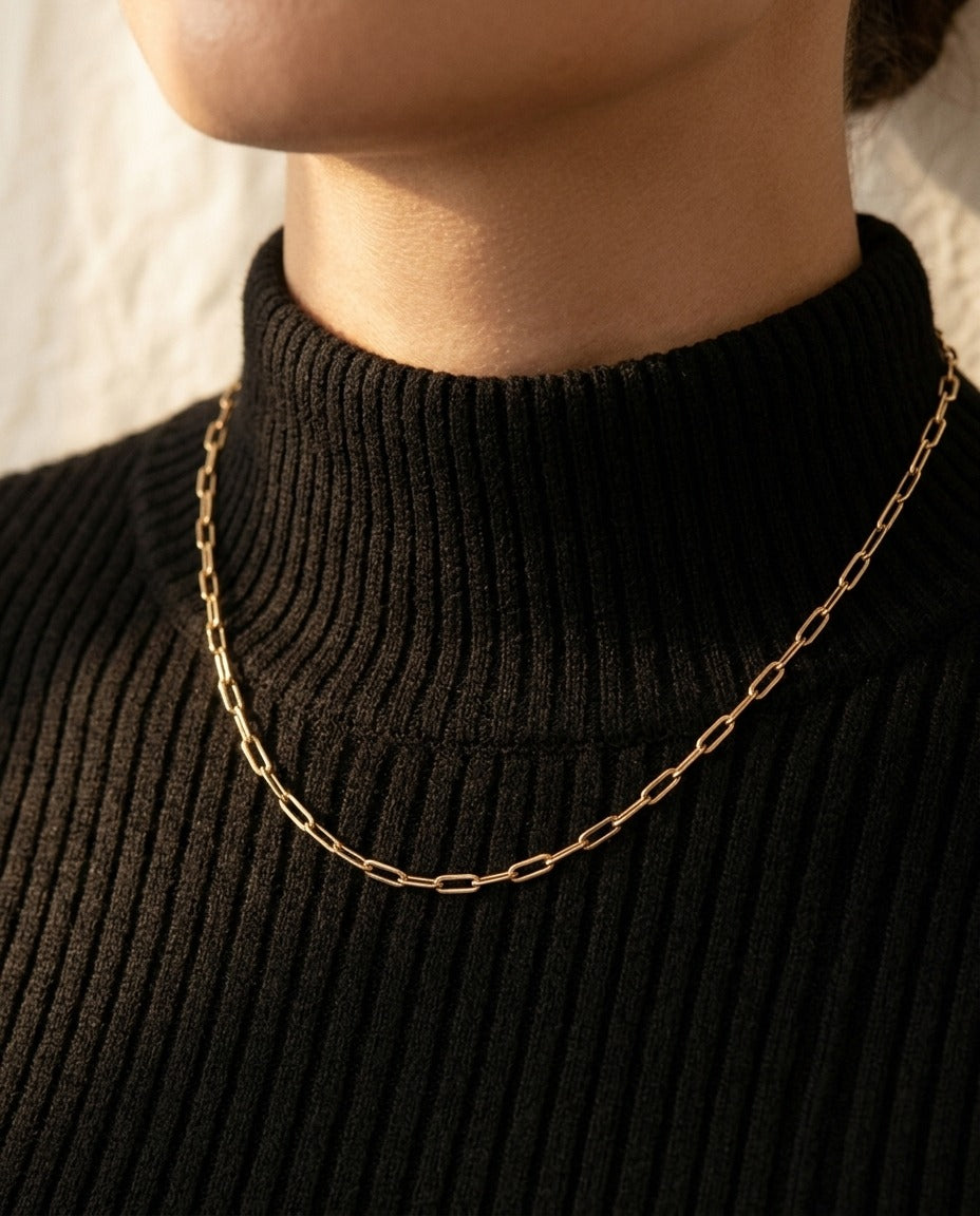 Whisper Chain Necklace worn over a black ribbed turtleneck